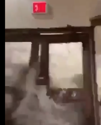 A freak wave smashes through doors at the Roi-Namur space tracking facility