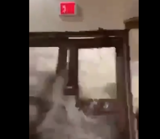 A freak wave smashes through doors at the Roi-Namur space tracking facility