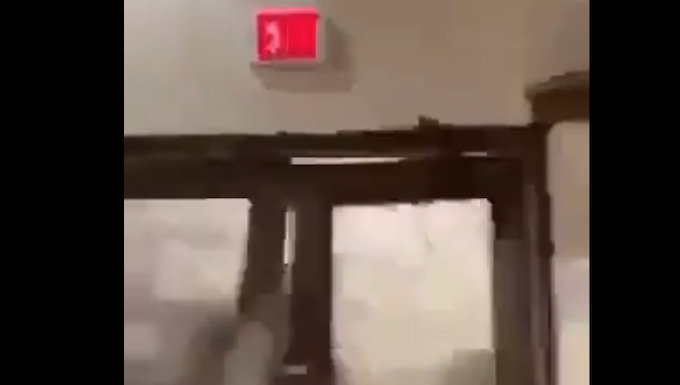 A freak wave smashes through doors at the Roi-Namur space tracking facility