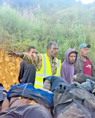 Horror . . . the bodies of tribesmen killed in Wapenamanda