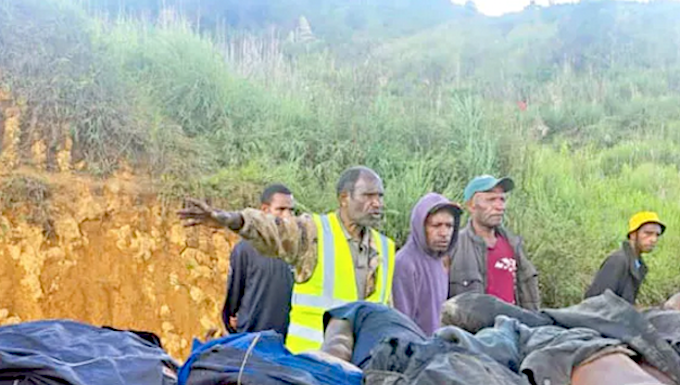 Horror . . . the bodies of tribesmen killed in Wapenamanda