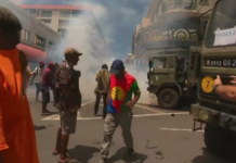 French police fire teargas during clashes with Union Calédonienne pro-independence protesters in central Nouméa