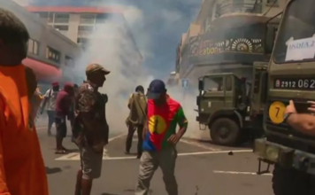 French police fire teargas during clashes with Union Calédonienne pro-independence protesters in central Nouméa