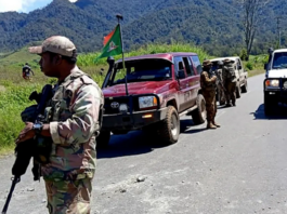 PNG Defence Force and police officers patrolling near the town of Wabag
