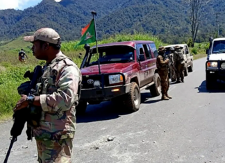 PNG Defence Force and police officers patrolling near the town of Wabag