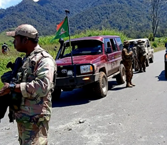PNG Defence Force and police officers patrolling near the town of Wabag