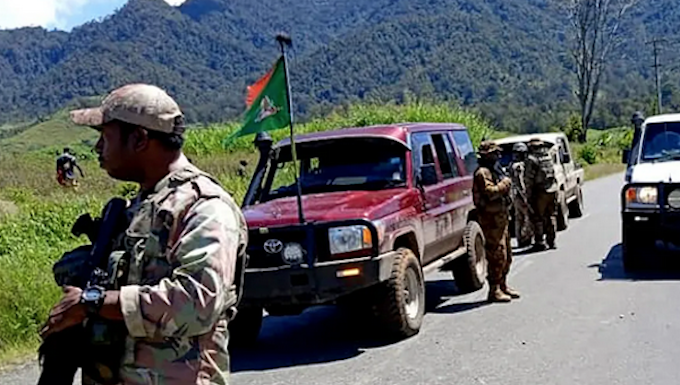 PNG Defence Force and police officers patrolling near the town of Wabag