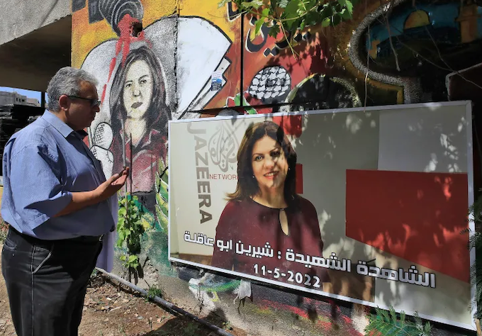A man visits the spot where Al Jazeera journalist Shireen Abu Akleh was killed 