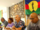 Pro-independence Union Calédonienne's spokesman Gilbert Tyuienon (centre) speaks to the media