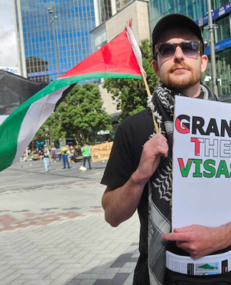 A protester in Auckland's Te Komititanga Square today