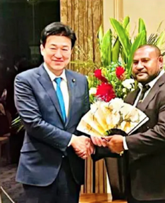 PNG's Defence Minister Dr Billy Joseph (right) being welcomed in Tokyo