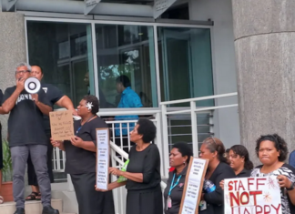 Frustrated employees of the University of the South Pacific dressed in black