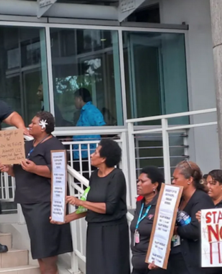 Frustrated employees of the University of the South Pacific dressed in black