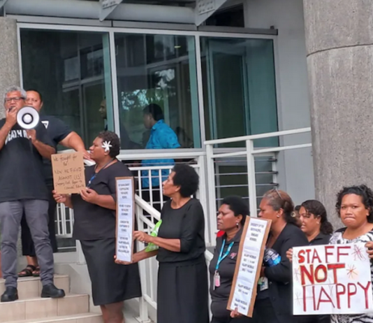 Frustrated employees of the University of the South Pacific dressed in black