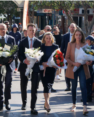 New South Wales Premier Chris Minns (second from left)