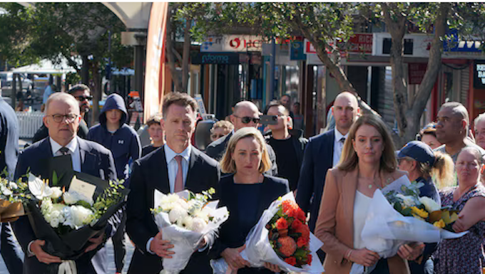 New South Wales Premier Chris Minns (second from left)