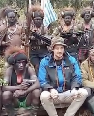 New Zealand hostage pilot Phillip Mehrtens (centre front in blue)