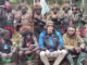New Zealand hostage pilot Phillip Mehrtens (centre front in blue)