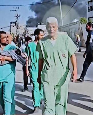 Doctors and medical staff, some rescuing babies, were ordered out of Gaza's Al-Awda Hospital