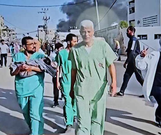 Doctors and medical staff, some rescuing babies, were ordered out of Gaza's Al-Awda Hospital