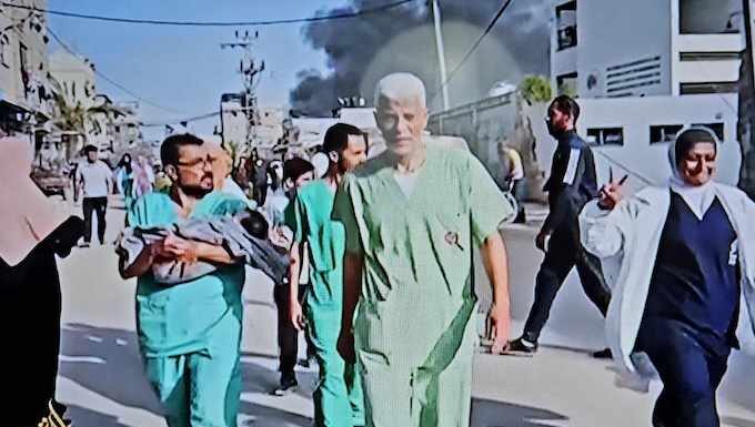 Doctors and medical staff, some rescuing babies, were ordered out of Gaza's Al-Awda Hospital