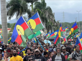 "No to neocolonialism" say Christian Tein of the protest group CCAT and thousands of Kanak protesters