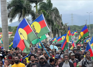 "No to neocolonialism" say Christian Tein of the protest group CCAT and thousands of Kanak protesters