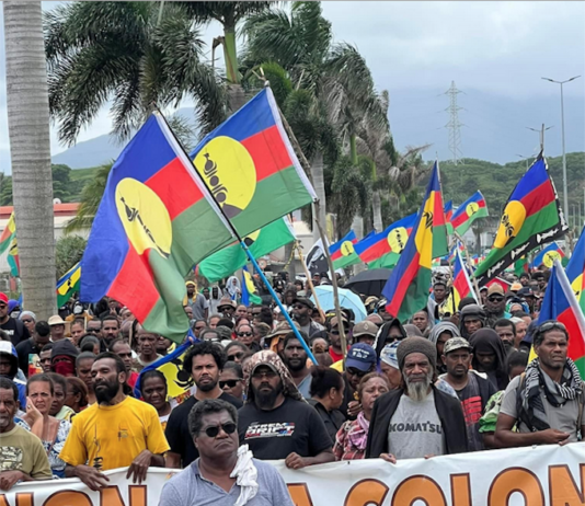 "No to neocolonialism" say Christian Tein of the protest group CCAT and thousands of Kanak protesters