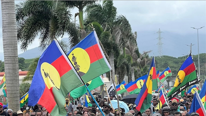 "No to neocolonialism" say Christian Tein of the protest group CCAT and thousands of Kanak protesters