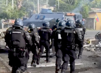 A French gendarme mobile force unit in a "mopping up" operation in Nouméa