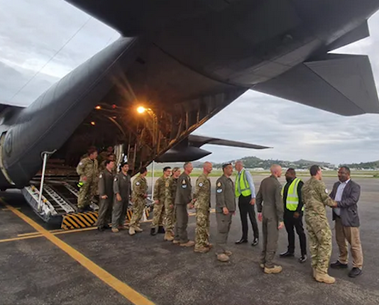 The NZ pilot and humanitarian relief crew being welcomed to Jackson's International Airport