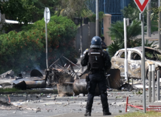 A French policeman on guard in a Nouméa street