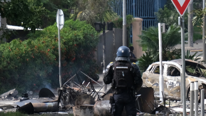 A French policeman on guard in a Nouméa street