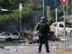 A French policeman on guard in a Nouméa street