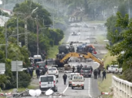Devastation on a Nouméa road as security forces try to clear pro-independence barricades