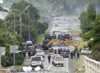 Devastation on a Nouméa road as security forces try to clear pro-independence barricades