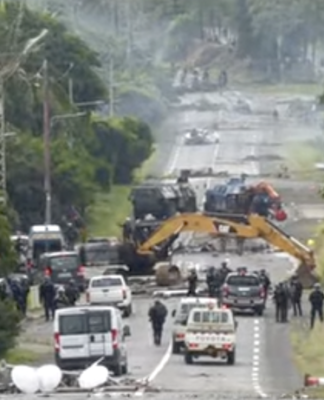 Devastation on a Nouméa road as security forces try to clear pro-independence barricades