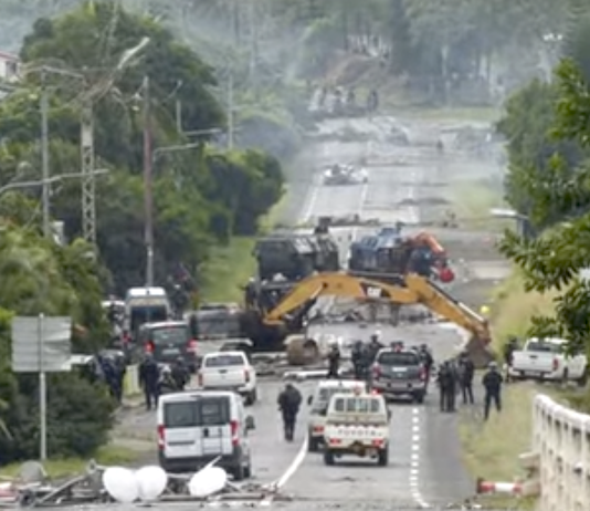 Devastation on a Nouméa road as security forces try to clear pro-independence barricades