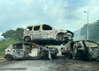 Piled up . . . burnt out cars block a road near Nouméa