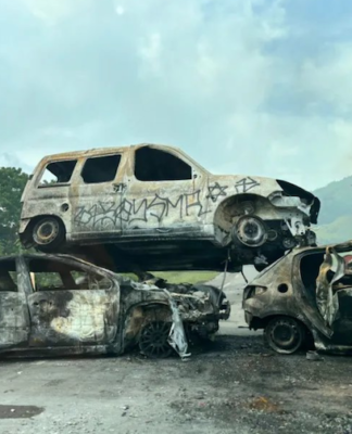 Piled up . . . burnt out cars block a road near Nouméa