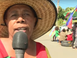 Poindimié resident Jeanne Pourouda talks to a Caledonia NC television reporter