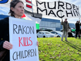 Protesters outside the offices of the electronics manufacturer Rakon