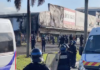 French riot police outside a torched shop in the New Caledonian capital Nouméa