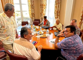 French Polynesia’s pro-France party leaders, including Edouard Fritch (left, standing) are holding back-to-back meetings