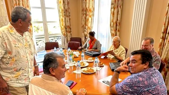 French Polynesia’s pro-France party leaders, including Edouard Fritch (left, standing) are holding back-to-back meetings