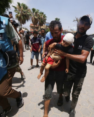 Injured Palestinians, including women and children, are brought to Al Aqsa Martyrs Hospital for treatment