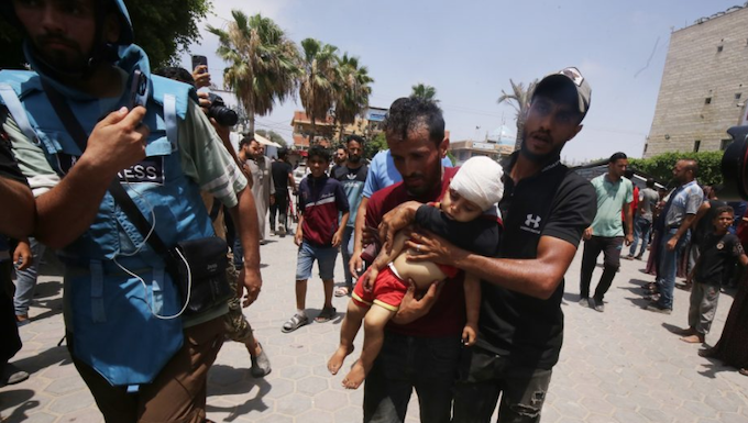 Injured Palestinians, including women and children, are brought to Al Aqsa Martyrs Hospital for treatment