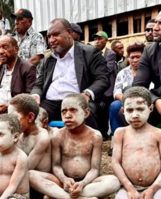 PNG Prime Minister James Marape (second from right) visits the Engan landslide area