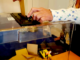 A New Caledonian resident places a vote at a ballot box in Nouméa