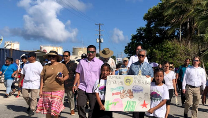 Hundreds of people marched in Majuro, capital of the Marshall Islands, on March 1